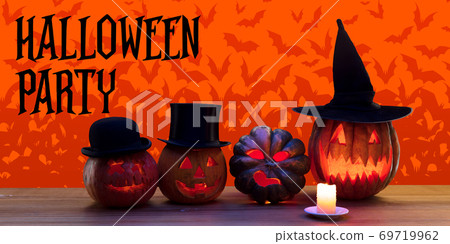 Scary pumpkins on orange background, the night of fear 69719962