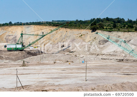 Large excavator working at the quarry for the extraction of amber, Kaliningrad region, Yantarny settlement.Large excavators working at the quarry Large excavator working at the quarry for the extraction of amber, Kaliningrad region, Yantarny settlement.Large excavators working at the quarry 69720500