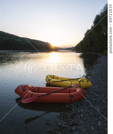 Orange and yellow packrafts rubber boats 69721614