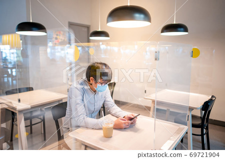 Sitting in shield partition for social distancing 69721904