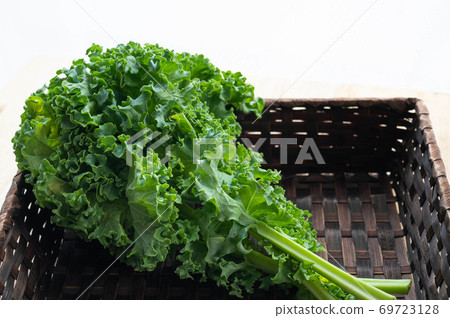 Kale leaves in a basket Kale leaves in a basket 69723128