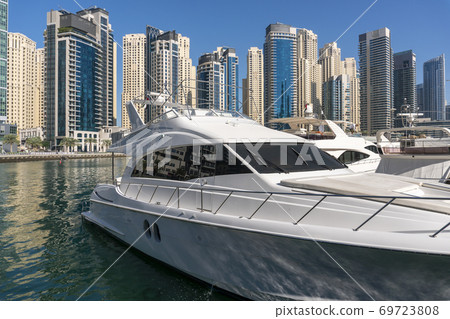Jacht and Skyscrapers Above the Water of Persian Gulf in Dubai Marina District in UAE 69723808