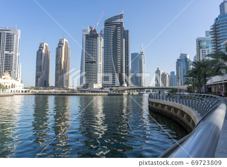 Jacht and Skyscrapers Above the Water of Persian Gulf in Dubai Marina District in UAE 69723809