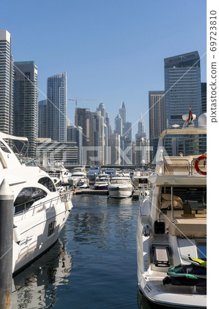 Jacht and Skyscrapers Above the Water of Persian Gulf in Dubai Marina District in UAE 69723810