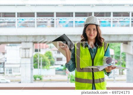 Female Civil engineer is working on tranportation development in Female Civil engineer is working on tranportation development in 69724173
