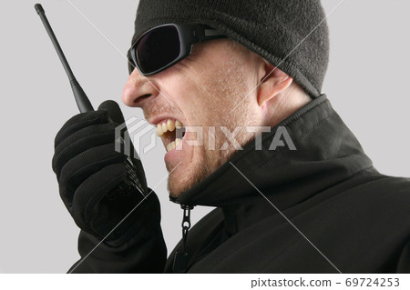 man in black spoke in an emotionally portable radio man in black spoke in an emotionally portable radio 69724253
