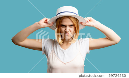 angry woman travel ban mad lady white hat 69724280
