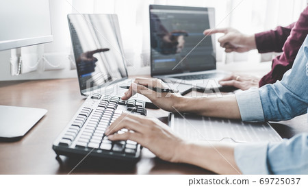Programmer working in a software development and coding technologies. Website design. Technology concept. Programmer working in a software development and coding technologies. Website design. Technology concept. 69725037
