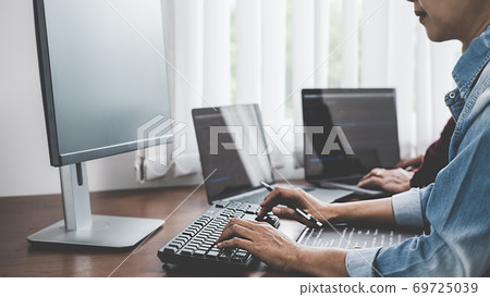 Programmer working in a software development and coding technologies. Website design. Technology concept. Programmer working in a software development and coding technologies. Website design. Technology concept. 69725039