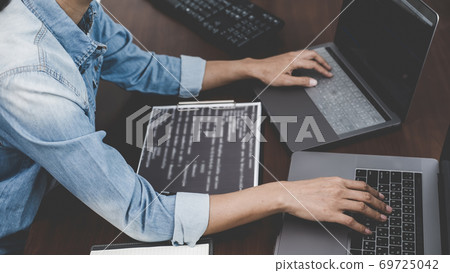 Programmer working in a software development and coding technologies. Website design. Technology concept. Programmer working in a software development and coding technologies. Website design. Technology concept. 69725042