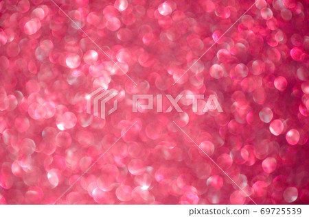 Red defocused glitter lights background. Rounded defocused lights. Abstract bokeh background with copy space and text place Red defocused glitter lights background. Rounded defocused lights. Abstract bokeh background with copy space and text place 69725539