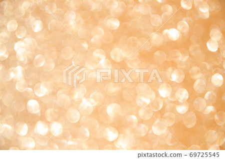 Golden defocused glitter lights background. Rounded defocused lights. Abstract bokeh background with copy space and text place. 69725545
