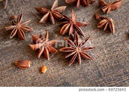 Star anise on a wooden table 69725643