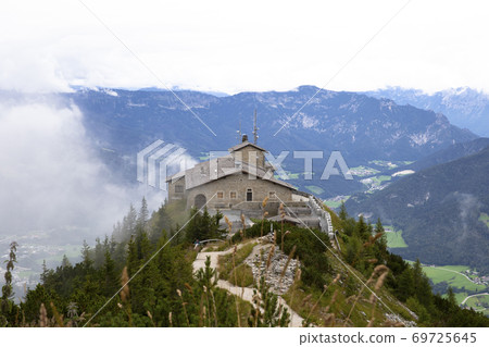 Kehlsteinhaus, Eagle Nest, Berchtesgaden in Germany, history place beautiful landscape on mountain peak with mist, cloudy background 69725645
