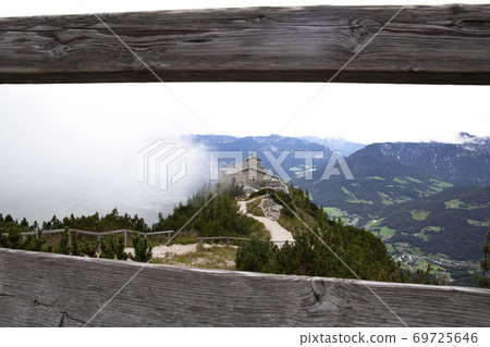 Kehlsteinhaus, Eagle Nest, Berchtesgaden in Germany, history place beautiful landscape on mountain peak with mist, cloudy background 69725646