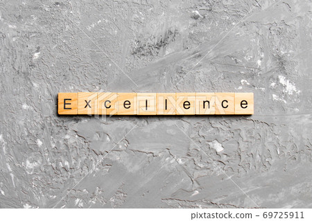 Excellence word written on wood block. Excellence text on cement table for your desing, concept Excellence word written on wood block. Excellence text on cement table for your desing, concept 69725911