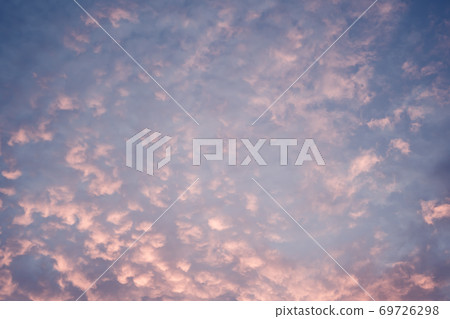 Celestial World concept. Dark purple blue pink natural bright sunset sky cumulus clouds. Background natural color of evening cloudscape panorama. Ideal for design wallpaper 69726298