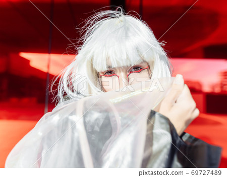 Stylish blonde on a red background. 69727489