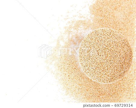 Quinoa in bowl and around on white background top view  with copy space. Healthy food 69729314