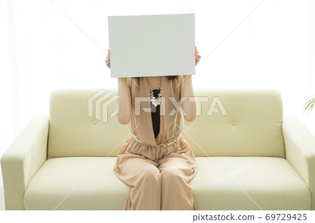 A woman with a message board A woman with a message board 69729425