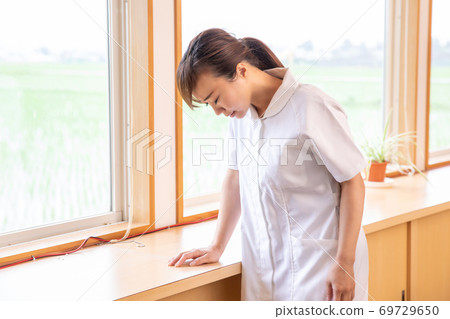 Depressed nurse Depressed nurse 69729650