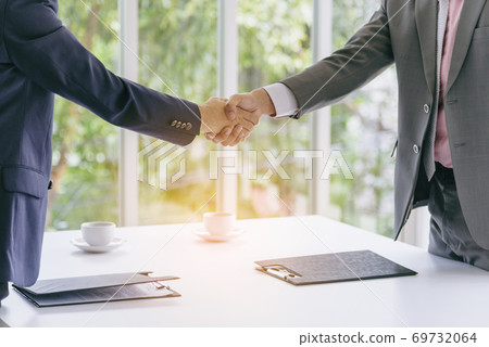 Sustainable Partner trust mission of ecosystem plant business holding green plant together symbolism Sustainable Partner trust mission of ecosystem plant business holding green plant together symbolism 69732064