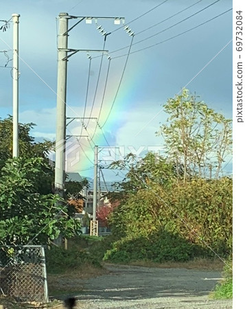 Scenery of the countryside road where you can see the rainbow Scenery of the countryside road where you can see the rainbow 69732084