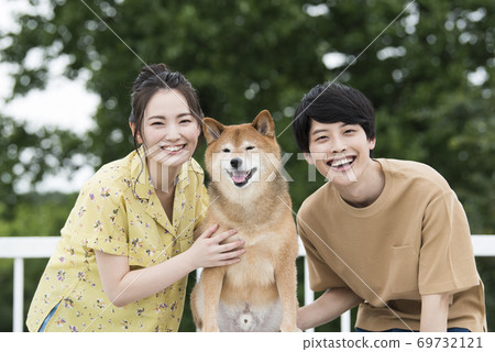 Couple and Shiba Inu portrait 69732121