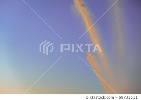 irrigation of a field against sky at sunset irrigation of a field against sky at sunset 69733511