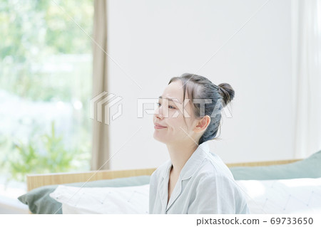 Waking up woman lacking sleep 69733650