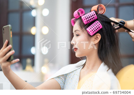 Woman in hair salon 69734004