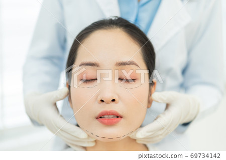 Woman cosmetic surgery Woman cosmetic surgery 69734142