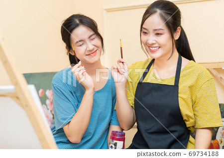 Woman painting 69734188