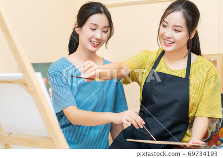 Woman painting 69734193