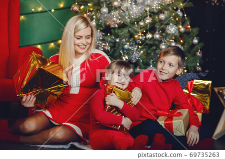 Family near Christmas gifts 69735263