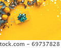 Christmas composition. Gold background with gift box and decorations. 69737828