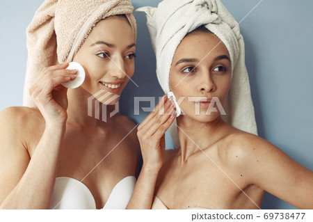 Beautiful girls standing in a studio with wadded disk 69738477