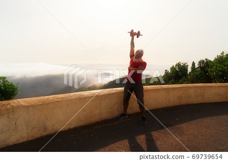 Senior man doing sport exercises 69739654