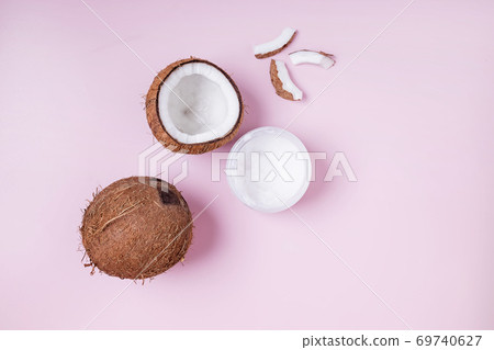 Coconuts on pink background, top view. 69740627