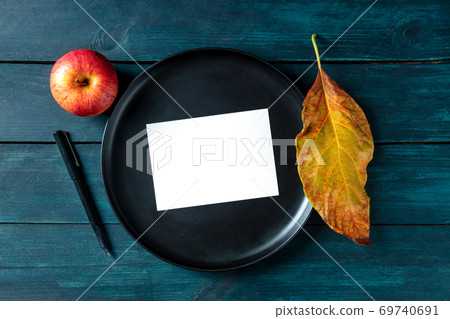 Autumn stationery mockup, a blank greeting card or invitation, shot from above on a tray with a place for text Autumn stationery mockup, a blank greeting card or invitation, shot from above on a tray with a place for text 69740691