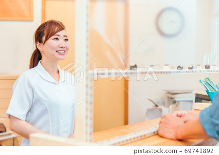 Medical staff and reception counter 69741892
