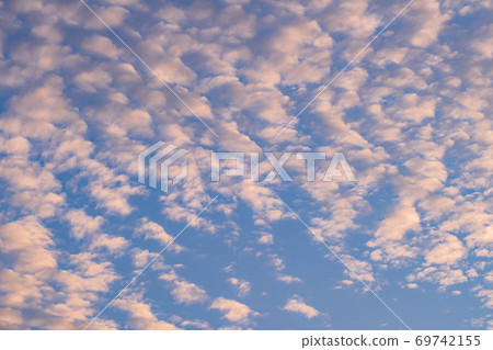 Scale clouds dyed in orange 69742155