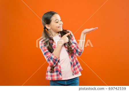 Check this out. Product presentation. Kid happy face show something copy space. Check this out. Product presentation. Kid happy face show something copy space. 69742539