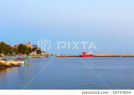 Pomorie, Bulgaria boats and houses in the evening Pomorie, Bulgaria boats and houses in the evening 69743604