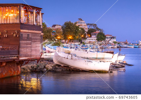 Pomorie, Bulgaria boats and houses in the evening Pomorie, Bulgaria boats and houses in the evening 69743605