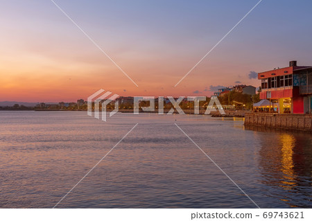 Pomorie, Bulgaria coastline, houses at sunset Pomorie, Bulgaria coastline, houses at sunset 69743621