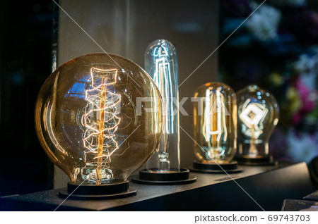 Beautiful illuminated festive light bulbs garland close up 69743703