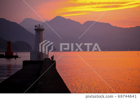 Nishi-Oita Port Lighthouse and Beppu Bay at dusk 69744641