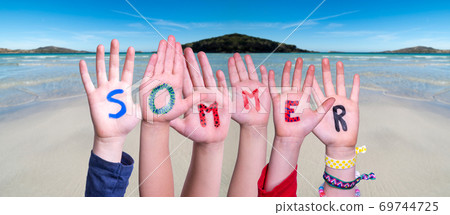 Children Hands Building Word Sommer Means Summer, Ocean Background 69744725