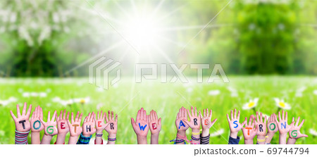 Children Hands Building Word Together We Are Strong, Grass Meadow 69744794